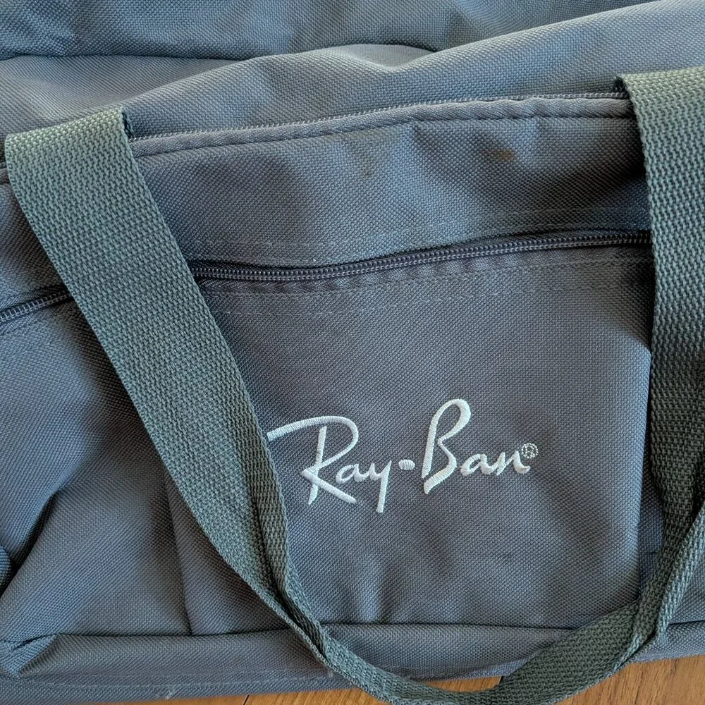 USED medium size duffle bag w/Ray Ban embroidered logo & never hide screen print